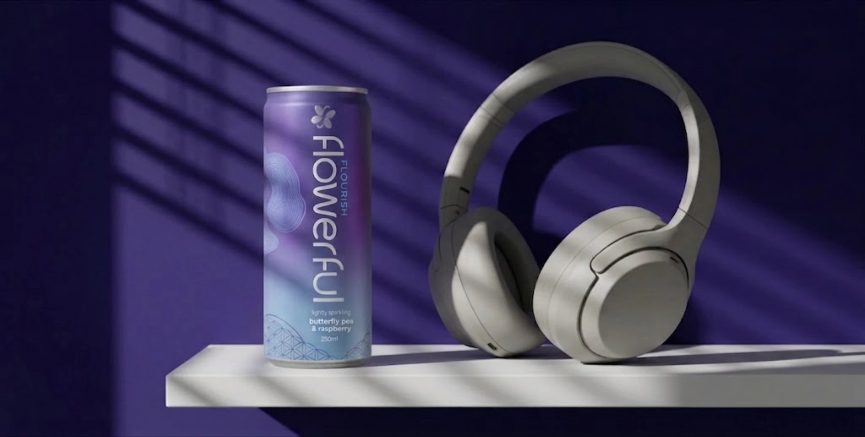 flowerful FLOURISH can styled beside headphones on a lit shelf